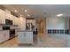 Bright kitchen with a breakfast bar, stainless steel appliances, and tiled backsplash at 10812 Applewood Range Way, Tampa, FL 33647