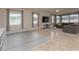 Bright living area with ample sunlight, tiled floors, and large sliding glass doors at 10812 Applewood Range Way, Tampa, FL 33647
