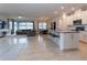 Spacious living area with a seamless open-concept design and abundant natural light at 10812 Applewood Range Way, Tampa, FL 33647