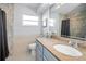 Bright bathroom with a large mirror, vanity, granite countertop, and decorative accents at 11077 87Th Ave, Seminole, FL 33772