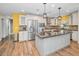 Spacious kitchen featuring a large island, stainless steel appliances, granite countertops, and ample cabinet storage at 11077 87Th Ave, Seminole, FL 33772