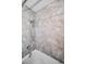 Shower featuring marble wall, bathtub, handheld shower head, and support bar at 11077 87Th Ave, Seminole, FL 33772