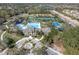 Aerial view of the community amenities including pools, tennis courts, and lush landscaping at 11620 Bristol Chase Dr, Tampa, FL 33626