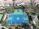 Aerial view of the community basketball courts, surrounded by mature landscaping and trees at 11620 Bristol Chase Dr, Tampa, FL 33626