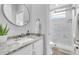 Clean bathroom featuring marble countertops, modern fixtures, and a glass-enclosed shower at 11620 Bristol Chase Dr, Tampa, FL 33626