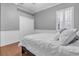 Comfortable bedroom featuring hardwood floors, white trim, and a ceiling fan at 11620 Bristol Chase Dr, Tampa, FL 33626