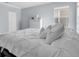 Cozy bedroom featuring a comfortable bed, a dresser, and a window at 11620 Bristol Chase Dr, Tampa, FL 33626