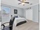 Bedroom featuring a ceiling fan, a window, and light-colored walls at 11620 Bristol Chase Dr, Tampa, FL 33626
