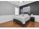 Comfortable bedroom featuring hardwood floors, white trim, and a ceiling fan at 11620 Bristol Chase Dr, Tampa, FL 33626