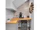 Stylish coffee bar area with wooden countertop and storage for wine and coffee accessories at 11620 Bristol Chase Dr, Tampa, FL 33626