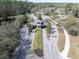 Aerial view of the community entrance with lush landscaping and secure access at 11620 Bristol Chase Dr, Tampa, FL 33626