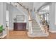 Inviting foyer boasts hardwood floors and a staircase leading to the second floor at 11620 Bristol Chase Dr, Tampa, FL 33626