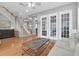 Grand foyer featuring a staircase, hardwood floors, and ample natural light at 11620 Bristol Chase Dr, Tampa, FL 33626