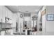Bright open kitchen with white cabinetry, stainless steel appliances, and center island at 11620 Bristol Chase Dr, Tampa, FL 33626