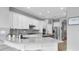 Bright kitchen with white cabinets, stainless steel appliances, and a large island at 11620 Bristol Chase Dr, Tampa, FL 33626