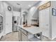 Bright kitchen featuring an island, stainless steel refrigerator, and modern finishes at 11620 Bristol Chase Dr, Tampa, FL 33626