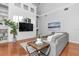 Bright and airy living room boasts a large built-in entertainment center and comfortable seating at 11620 Bristol Chase Dr, Tampa, FL 33626