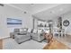Open-concept living room features modern decor and seamlessly connects to the kitchen and dining area at 11620 Bristol Chase Dr, Tampa, FL 33626