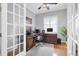 Bright office space with hardwood floors, white trim, and large windows at 11620 Bristol Chase Dr, Tampa, FL 33626