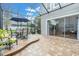 Screened patio with a dining area and cozy seating for outdoor entertainment at 11620 Bristol Chase Dr, Tampa, FL 33626