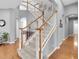 Grand foyer featuring a staircase with wood handrails and white balusters leading to the upper level at 11620 Bristol Chase Dr, Tampa, FL 33626