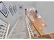 View from the top of the staircase looking down to the hardwood flooring of the foyer at 11620 Bristol Chase Dr, Tampa, FL 33626