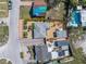Aerial view of a landscaped home, showcasing an ample-sized lot and well-maintained landscaping at 14066 Marguerite Dr, Madeira Beach, FL 33708