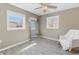 Well-lit bedroom with wood floors, a tall mirror, and ample natural light at 14066 Marguerite Dr, Madeira Beach, FL 33708