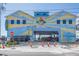 The Madeira Beach Car Wash with unique colorful architecture, decorative car and tropical theme at 14066 Marguerite Dr, Madeira Beach, FL 33708