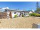 Rear exterior showcasing the patio and landscaping at 14066 Marguerite Dr, Madeira Beach, FL 33708