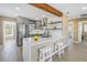 Modern kitchen features stainless steel appliances, white countertops, and gray cabinetry at 14066 Marguerite Dr, Madeira Beach, FL 33708