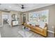 Cozy living room featuring natural light, neutral decor and tiled floors at 14066 Marguerite Dr, Madeira Beach, FL 33708