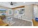 Open-concept living space with stylish gray cabinets and an exposed beam at 14066 Marguerite Dr, Madeira Beach, FL 33708