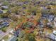 Overhead shot of the property with red outline showcasing its location amidst mature trees and homes at 1715 W Hollywood St, Tampa, FL 33604