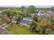 A view of the home's exterior and yard with lush landscaping and mature trees at 1730 Michigan Ne Ave, St Petersburg, FL 33703