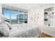 Bright bedroom featuring a large window overlooking the bay and decorative mirrors on the wall at 175 1St S St # 1104, St Petersburg, FL 33701