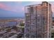 Modern condo building with waterfront views, showcasing its architectural design and surrounding cityscape at 175 1St S St # 1104, St Petersburg, FL 33701