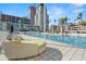 Resort-style pool area with comfortable lounge seating, ideal for a relaxing day under the sun at 175 1St S St # 1104, St Petersburg, FL 33701