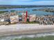 Aerial view of condo buildings on sandy beach, showcasing ocean and bay views at 17920 Gulf Blvd # 702, Redington Shores, FL 33708