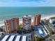 Beautiful aerial view of oceanfront condo complex featuring pristine beach and covered parking at 17920 Gulf Blvd # 702, Redington Shores, FL 33708