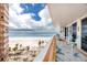 Balcony with beautiful ocean views, seating, and a decorative rug, perfect for relaxing at 17920 Gulf Blvd # 702, Redington Shores, FL 33708