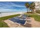 Beachfront lawn area features lounge chairs for resident to enjoy the ocean views at 17920 Gulf Blvd # 702, Redington Shores, FL 33708