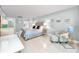 Comfortable bedroom featuring a bed, chair and desk with modern décor and serene ambiance at 17920 Gulf Blvd # 702, Redington Shores, FL 33708