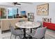 Cozy dining area with a marble table and seating, offering a pleasant view at 17920 Gulf Blvd # 702, Redington Shores, FL 33708