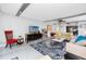 Spacious living room featuring a plush rug, comfortable seating, and neutral colors at 17920 Gulf Blvd # 702, Redington Shores, FL 33708