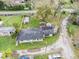 Aerial view of home with large lot including multiple outbuildings at 18108 Crooked Ln, Lutz, FL 33548