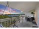Enjoy the covered balcony with a swing and comfortable outdoor furniture overlooking the calm water at 19727 Gulf Blvd # 209, Indian Shores, FL 33785