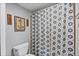 Nautical-themed bathroom featuring a decorative shower curtain and tasteful wall art at 19727 Gulf Blvd # 209, Indian Shores, FL 33785