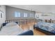 Bright loft bedroom featuring hardwood floors, a ceiling fan, and comfortable furnishings at 19727 Gulf Blvd # 209, Indian Shores, FL 33785