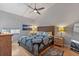Serene bedroom featuring a ceiling fan, wooden accents, and coordinating nightstands for a cozy and stylish retreat at 19727 Gulf Blvd # 209, Indian Shores, FL 33785